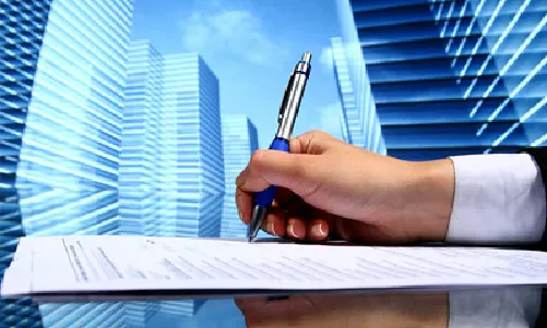 Businessman signing contract, Dubai